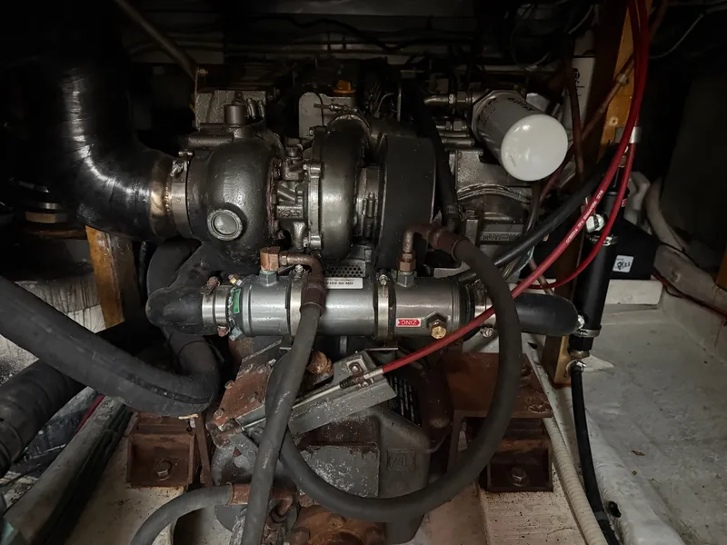 Slide: The Image of Engine compartment of a 1998 Wilbur 38 Downeast boat, showcasing mechanical components. - 26