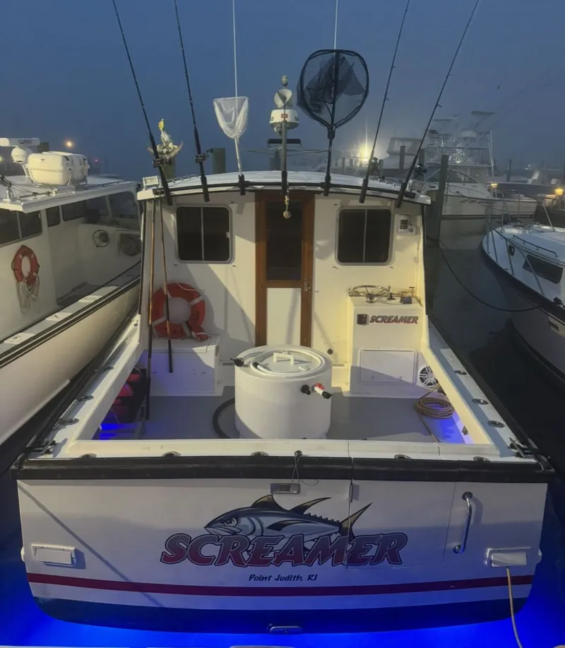 Slide: The Image of 1998 Wilbur 38 Downeast boat "Screamer" docked at night with fishing gear. - 4