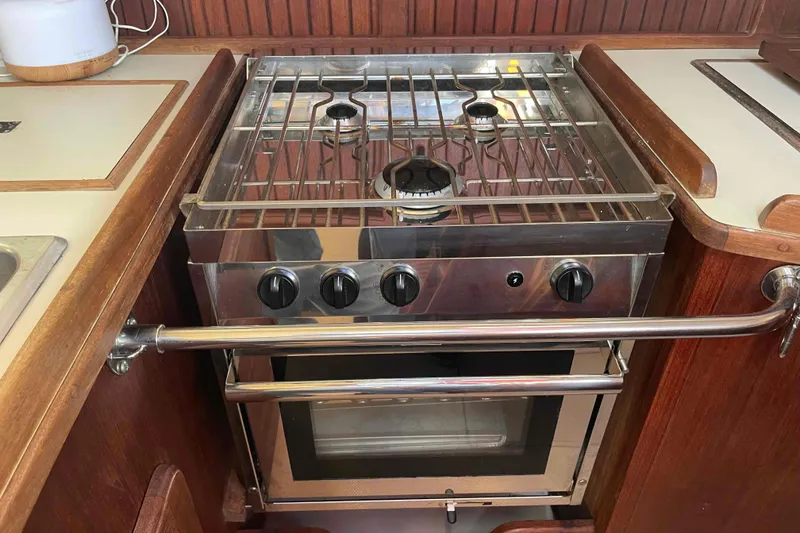 Slide: The Image of Stainless steel stove and oven in 1989 Island Packet 35 yacht kitchen. - 19