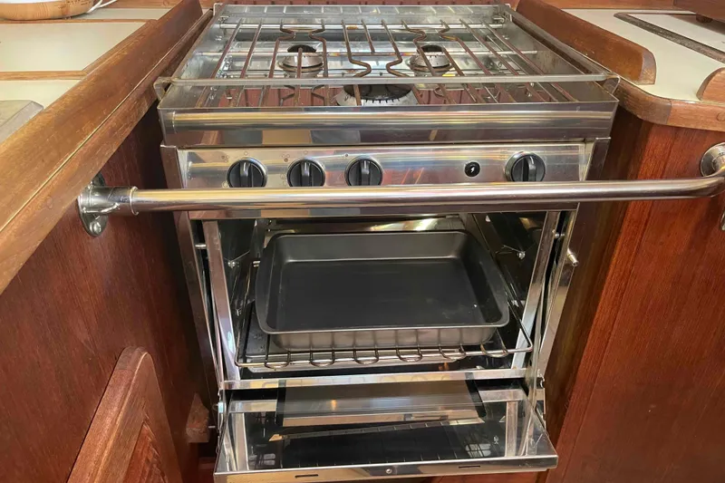 Slide: The Image of Stainless steel stove and oven in 1989 Island Packet 35 yacht kitchen. - 20