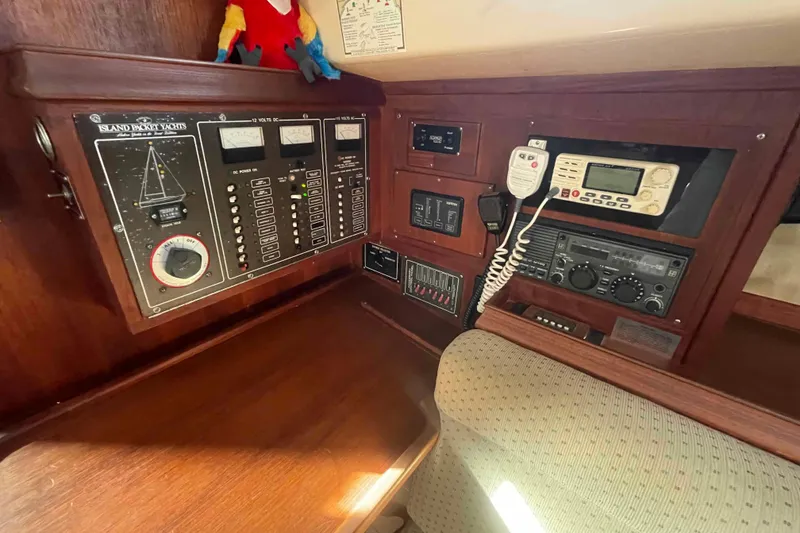 Slide: The Image of Control panel of a 1989 Island Packet 35 yacht with navigation and communication equipment. - 25