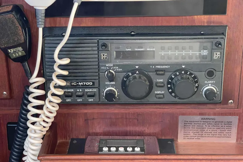 Slide: The Image of Icom IC-M700 radio on 1989 Island Packet 35 sailboat, featuring controls and microphone. - 29