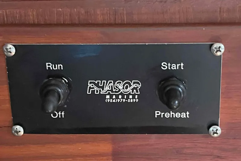 Slide: The Image of Control panel with switches for "Run," "Off," "Start," and "Preheat" on Island Packet 35, 1989. - 31