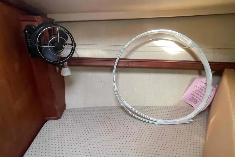 Slide: The Image of 1989 Island Packet 35 interior with fan and circular object on patterned surface. - 38