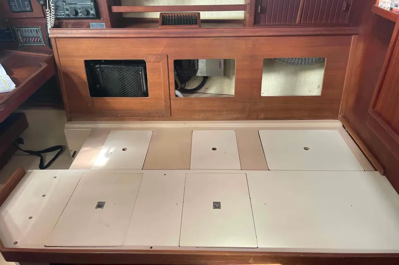 Slide: The Image of Interior view of 1989 Island Packet 35 sailboat with storage compartments. - 39