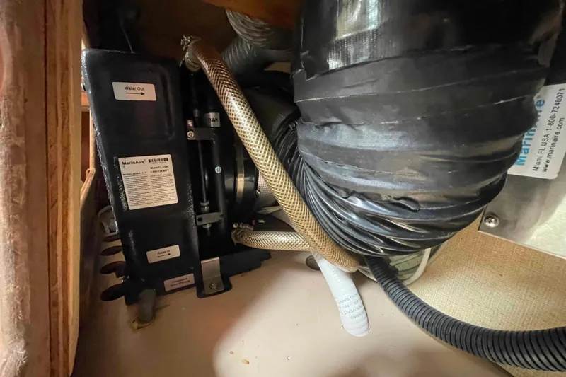 Slide: The Image of 1989 Island Packet 35 boat interior showing MarinAire unit and ductwork. - 45