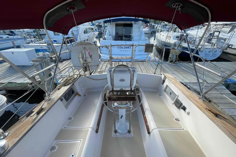 Slide: The Image of Cockpit view of 1989 Island Packet 35 sailboat docked at marina. - 58