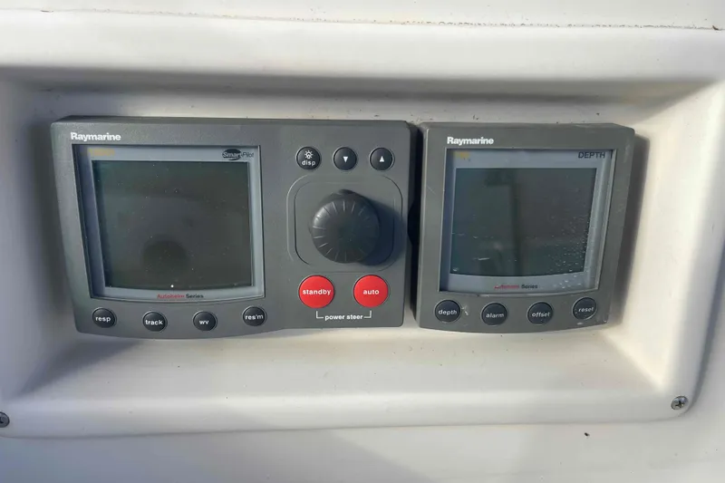 Slide: The Image of Raymarine navigation instruments on 1989 Island Packet 35 sailboat dashboard. - 64