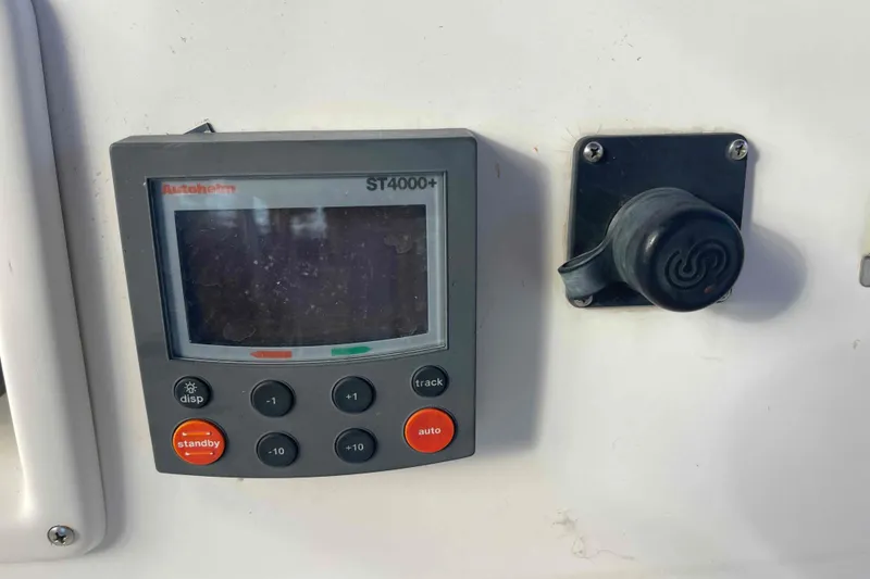 Slide: The Image of Autopilot control panel on 1989 Island Packet 35 sailboat, featuring Autohelm ST4000+ display. - 65