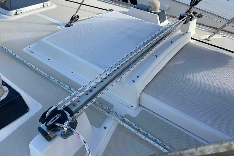 Slide: The Image of 1989 Island Packet 35 sailboat docked in a marina, surrounded by other boats. - 69