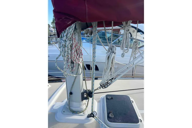 Slide: The Image of 1989 Island Packet 35 sailboat with rigging and marina background. - 73