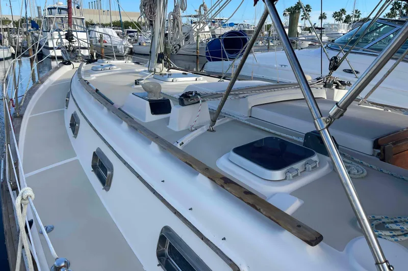 Slide: The Image of Sailboat rigging on a 1989 Island Packet 35, featuring ropes and deck details. - 74