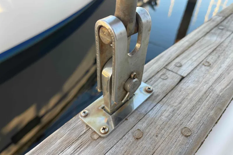 Slide: The Image of 1989 Island Packet 35 sailboat deck view in marina, showcasing rigging and hatches. - 75