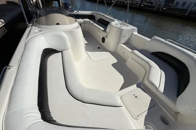 Slide: The Image of 2011 Hurricane SunDeck Sport 201 OB boat with spacious seating and sleek design. - 19