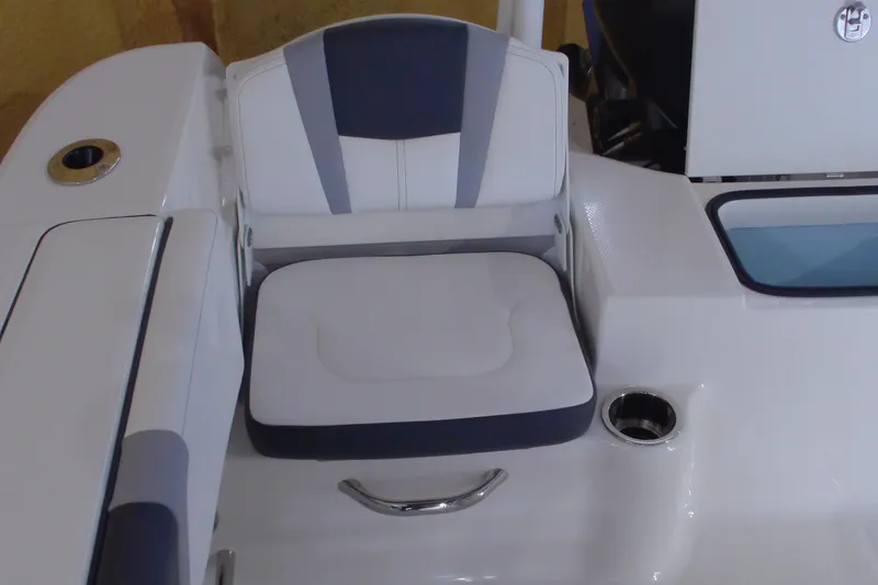 Slide: The Image of 2026 Robalo R200 Center Console boat seat with cup holder and sleek design. - 12