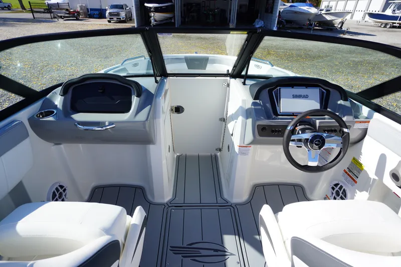 Slide: The Image of 2026 Chaparral 21 SSi OB boat interior with modern dashboard and steering wheel. - 15