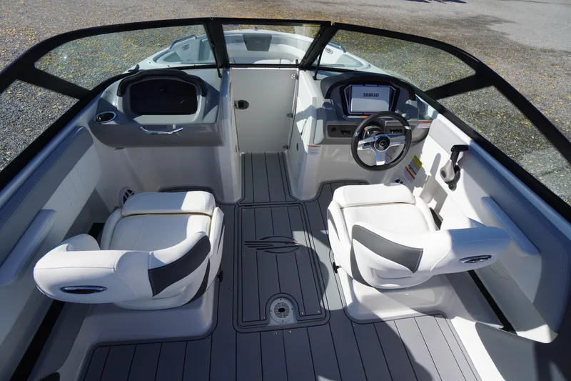 Slide: The Image of 2026 Chaparral 21 SSi OB boat interior with modern seating and dashboard. - 16