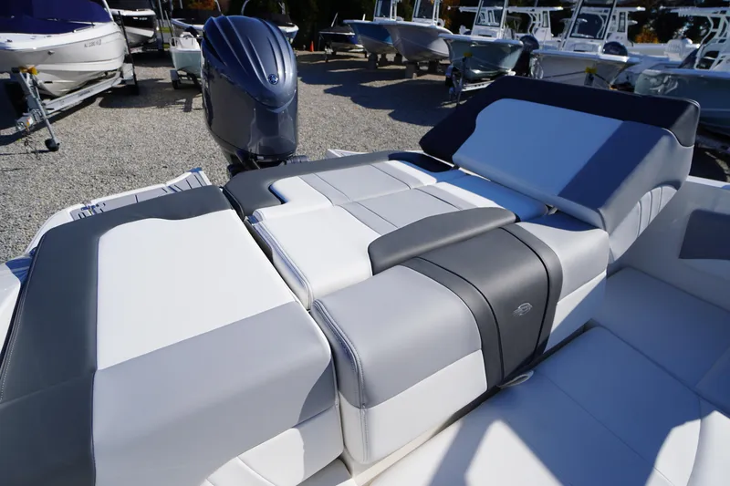 Slide: The Image of 2026 Chaparral 21 SSi OB boat with sleek seating and powerful outboard motor. - 43