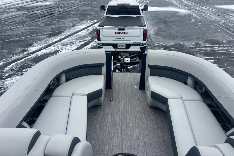 Slide: The Image of 2026 Harris Grand Mariner 230 pontoon boat interior with truck in snowy parking lot. - 10