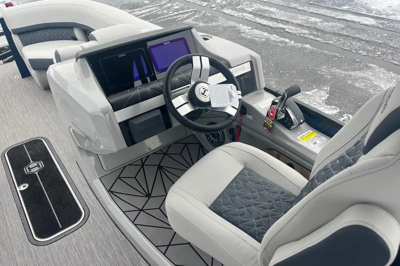 Slide: The Image of 2026 Harris Grand Mariner 230 boat interior with modern dashboard and luxurious seating. - 11