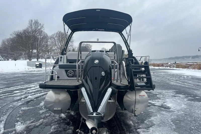 Slide: The Image of 2026 Harris Grand Mariner 230 pontoon boat on icy winter shoreline. - 5