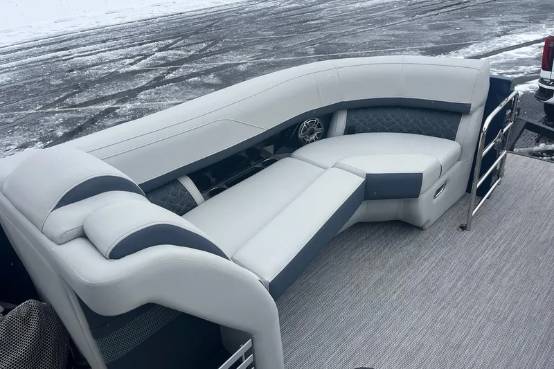 Slide: The Image of 2026 Harris Grand Mariner 230 boat interior with luxurious seating on a snowy day. - 8