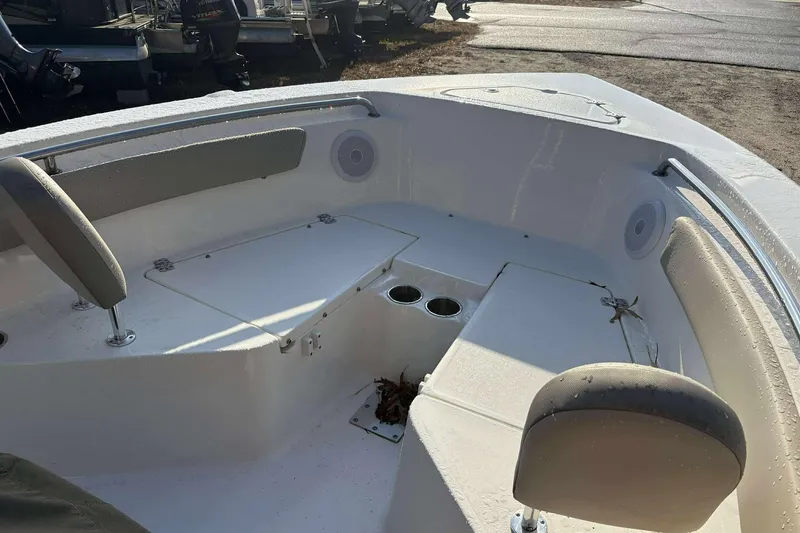 Slide: The Image of 2023 Key West 203 FS boat interior with seating and cup holders. - 12
