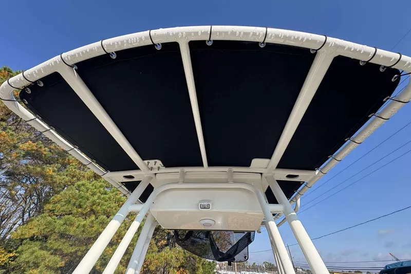 Slide: The Image of 2023 Key West 203 FS boat canopy against clear blue sky. - 18