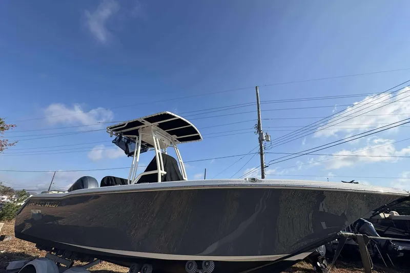 Slide: The Image of 2023 Key West 203 FS boat with T-top under clear blue sky. - 5