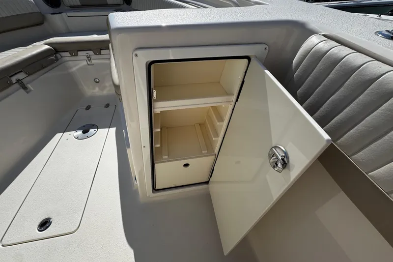 Slide: The Image of 2019 Sea Chaser 27 HFC boat interior storage compartment with open door. - 11