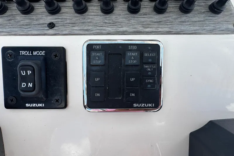Slide: The Image of Control panel of a 2019 Sea Chaser 27 HFC boat with Suzuki troll mode. - 18