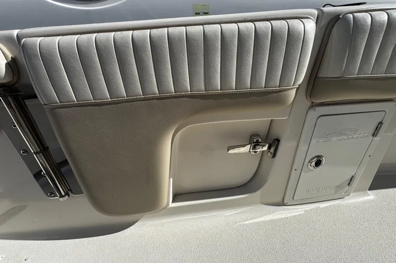 Slide: The Image of 2019 Sea Chaser 27 HFC boat interior with padded seating and washdown compartment. - 21