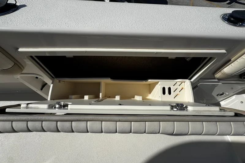 Slide: The Image of 2019 Sea Chaser 27 HFC boat storage compartment with open hatch. - 28