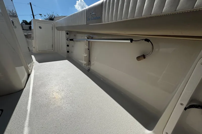 Slide: The Image of 2019 Sea Chaser 27 HFC boat interior with storage and seating area. - 30