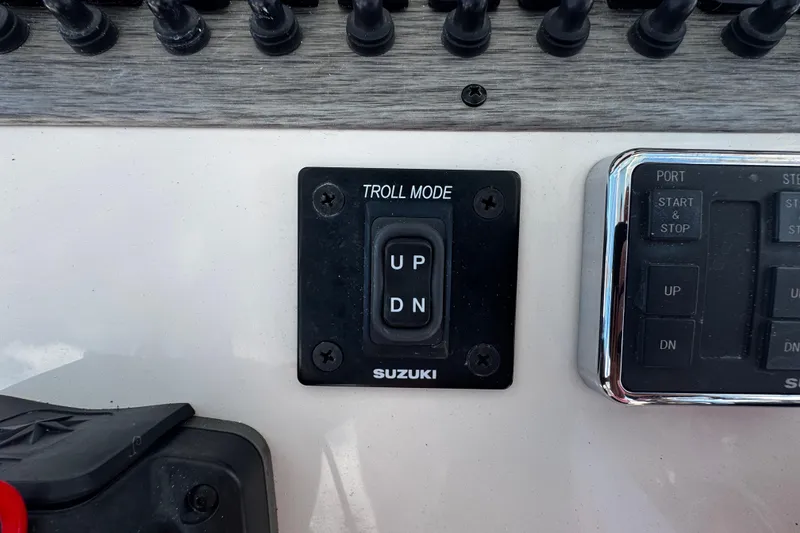 Slide: The Image of Control panel of 2019 Sea Chaser 27 HFC with Suzuki troll mode switch. - 19