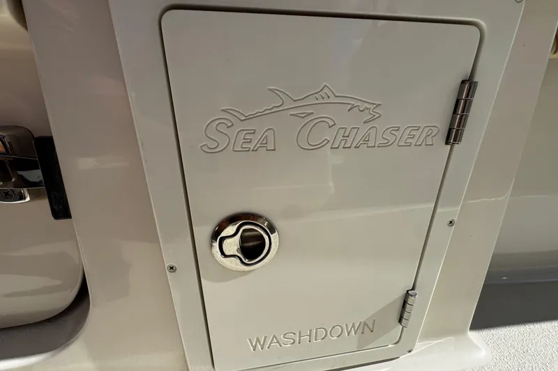 Slide: The Image of 2019 Sea Chaser 27 HFC washdown compartment with logo and handle. - 22
