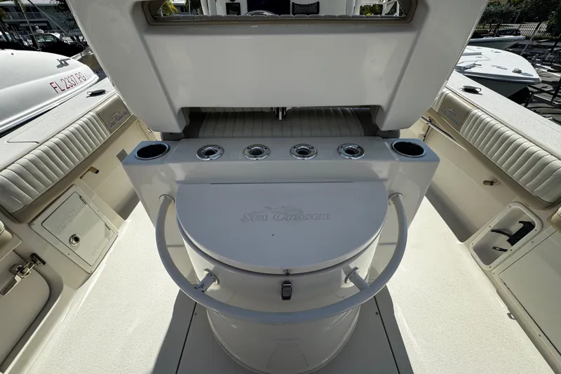 Slide: The Image of 2019 Sea Chaser 27 HFC boat interior with seating and storage compartments. - 25