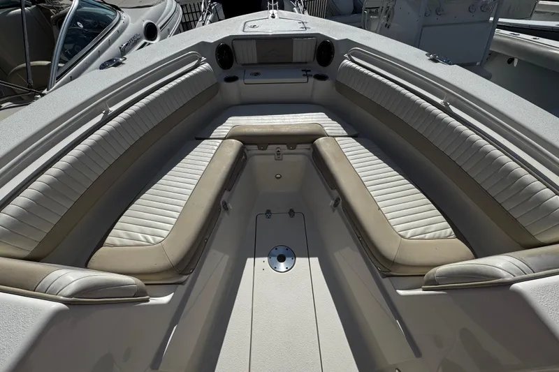 Slide: The Image of 2019 Sea Chaser 27 HFC boat interior with cushioned seating and storage compartments. - 3