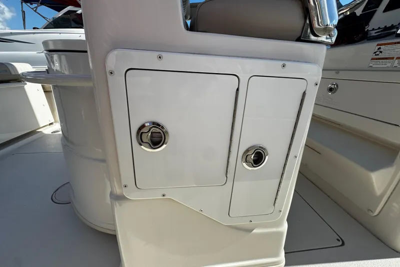 Slide: The Image of 2019 Sea Chaser 27 HFC boat interior storage compartments with chrome handles. - 31