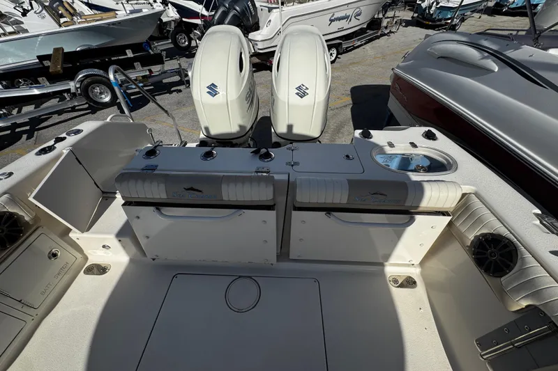 Slide: The Image of 2019 Sea Chaser 27 HFC boat interior with dual engines and seating area. - 34