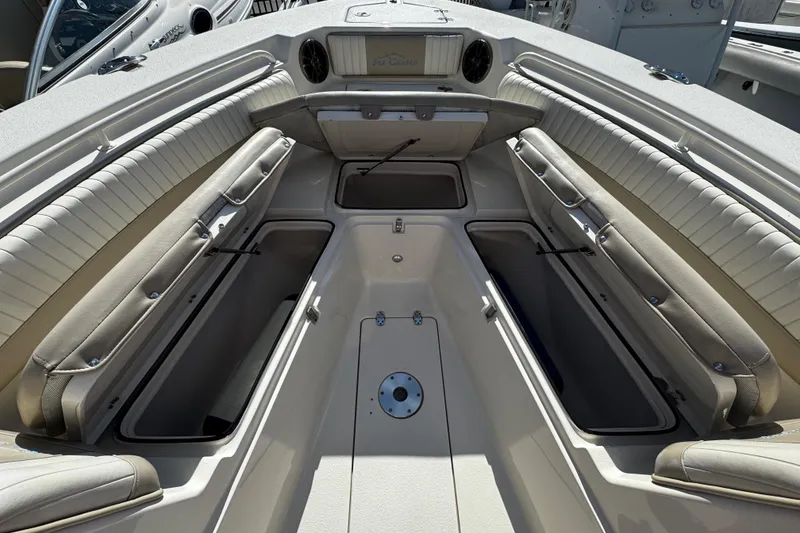 Slide: The Image of 2019 Sea Chaser 27 HFC boat interior with open storage compartments and seating. - 4