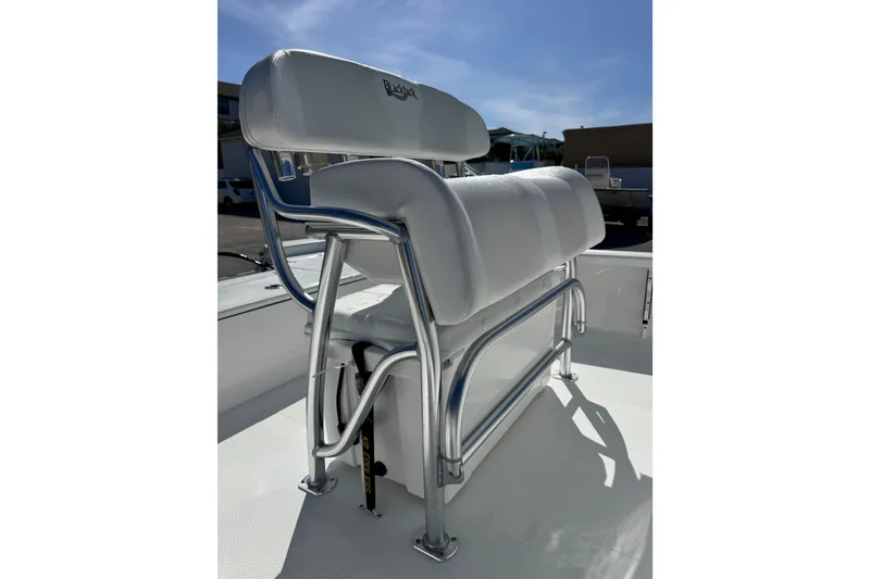 Slide: The Image of 2026 BlackJack 224 boat seat with sleek metal frame and cushioned backrest. - 11