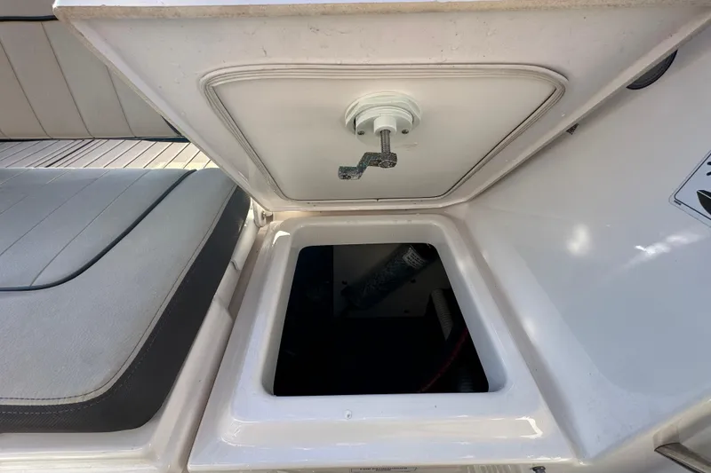 Slide: The Image of Open storage compartment on 2022 Yamaha Boats 252 FSH Sport. - 110