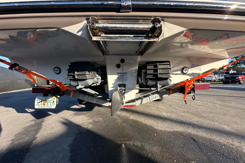 Slide: The Image of 2022 Yamaha Boats 252 FSH Sport, rear view, showcasing spacious deck and seating. - 12