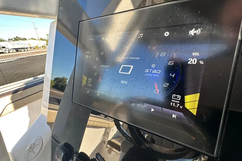 Slide: The Image of Dashboard of 2022 Yamaha Boats 252 FSH Sport showing digital controls and gauges. - 38