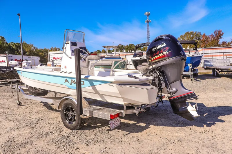 Slide: The Image of 2023 Avid 19 FS boat with Yamaha engine on trailer in outdoor setting. - 6