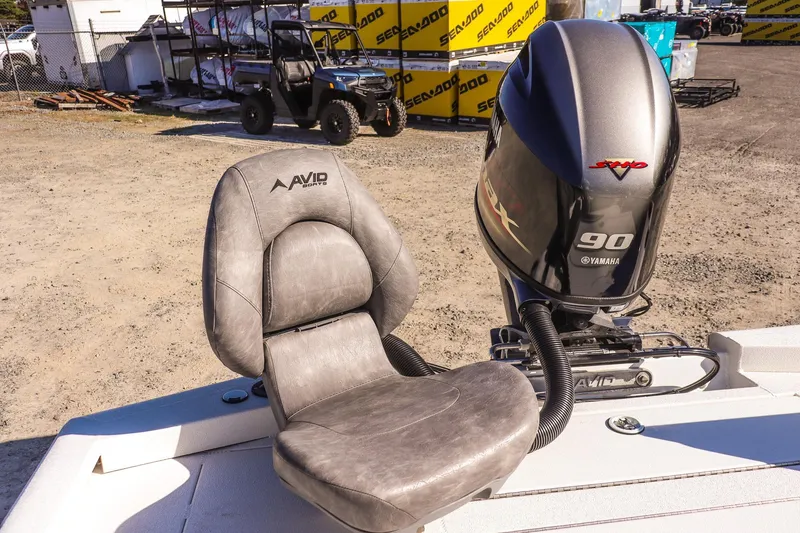 Slide: The Image of 2023 Avid 19 FS boat seat and Yamaha 90 engine in outdoor setting. - 8