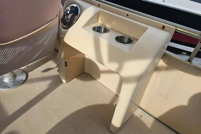 Slide: The Image of 2008 Sanpan 2200 RE-3 Gate boat interior with cup holders and speaker. - 20