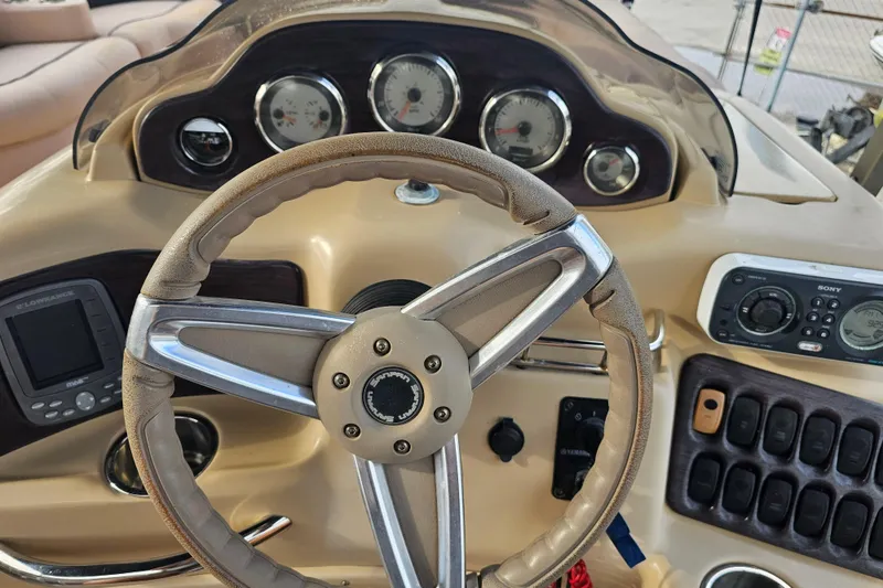 Slide: The Image of Steering console of 2008 Sanpan 2200 RE-3 Gate boat with gauges and controls. - 5