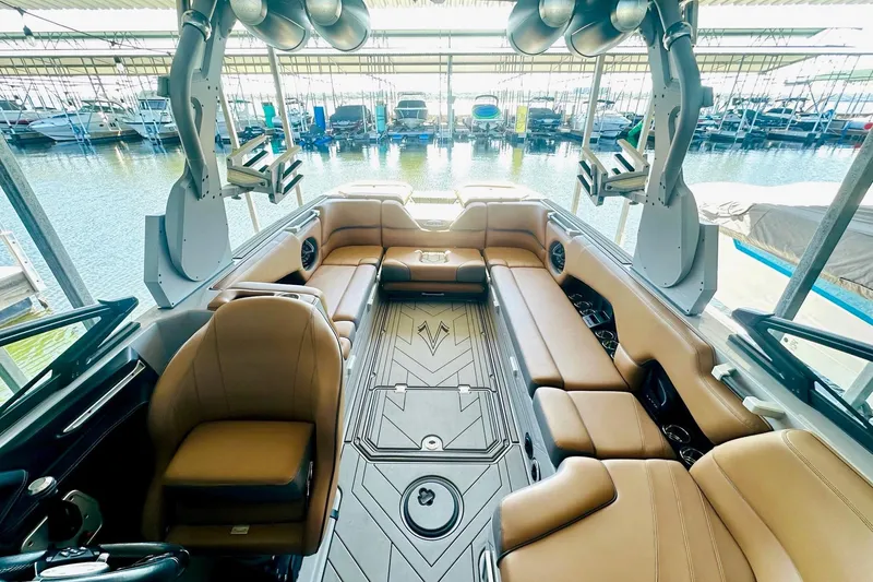 Slide: The Image of 2020 Supra SE550 boat interior with luxurious seating and advanced sound system. - 24